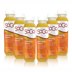six- 12 oz bottles of SoGo Immunity Boost Juice arranged in a row, citurs juices with organic ginger and turmeric and superfoods