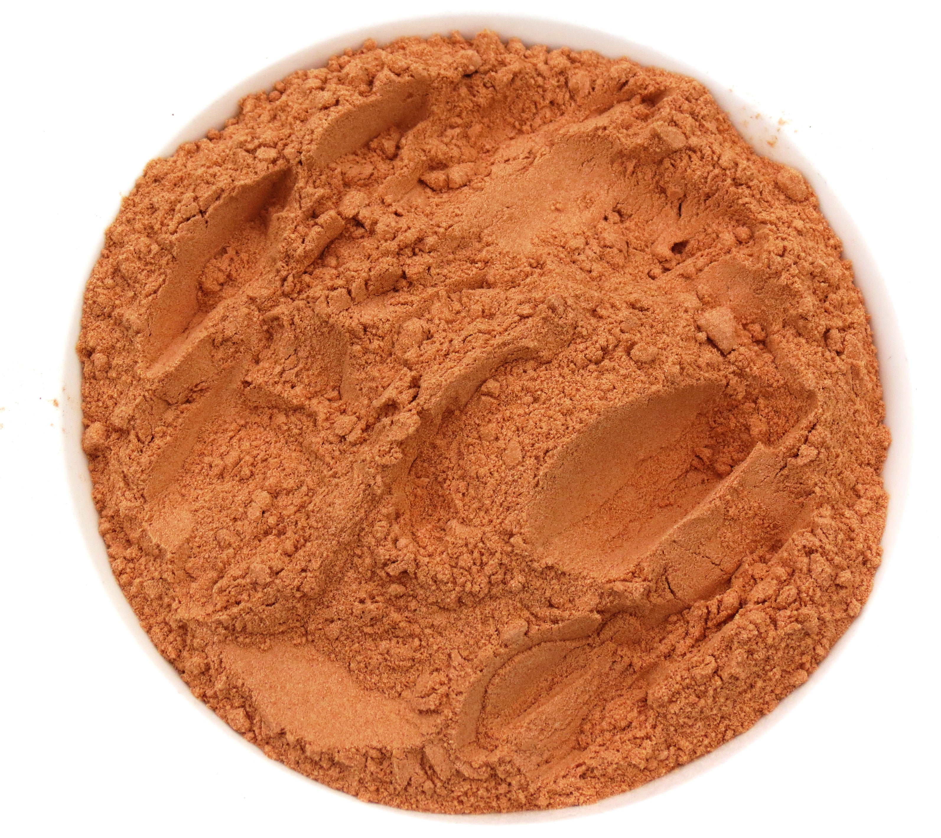 A white bowl of SoGo Pure Maca Mocha Me powder, a mix of cacao, maca, and astragalus